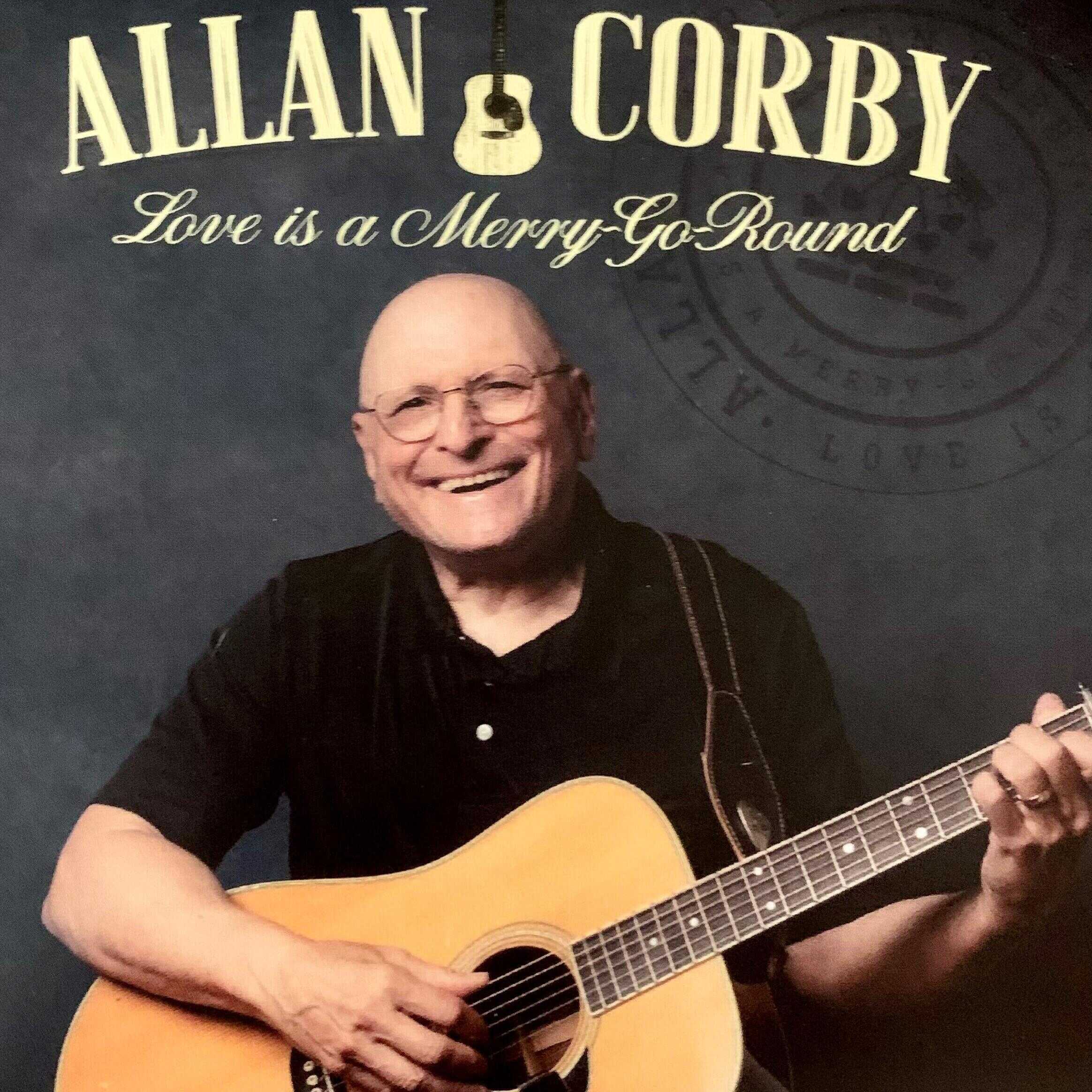 https://cdn.indiemusicreviews.net/images/allan-corby-inspires-with-the-guitar-in-latest-album-love-is-a-merry-go-round.jpg