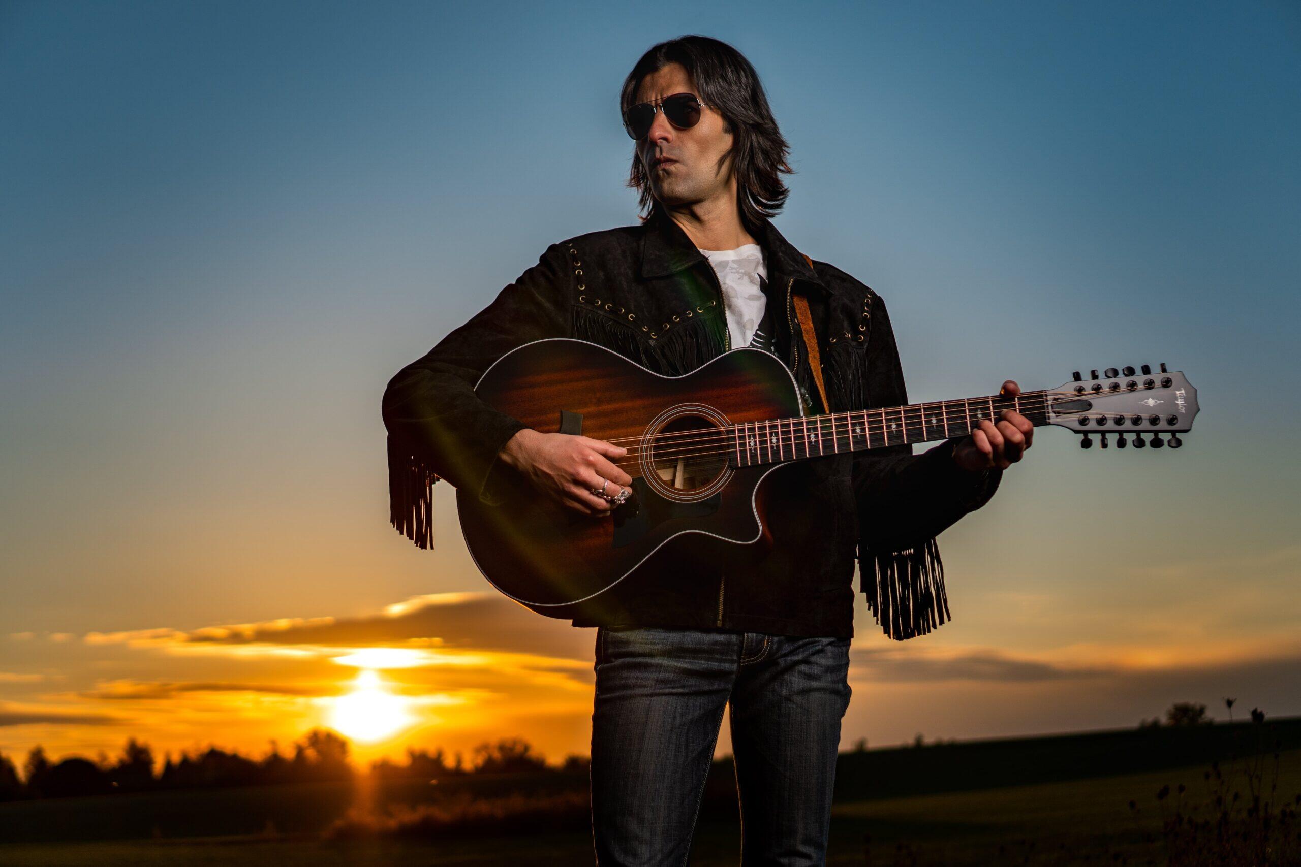 https://cdn.indiemusicreviews.net/images/embrace-the-raw-melancholic-melodies-of-americana-with-transformative-storytelling-singer-artist-damien-rattler-drops-new-album-2.jpg